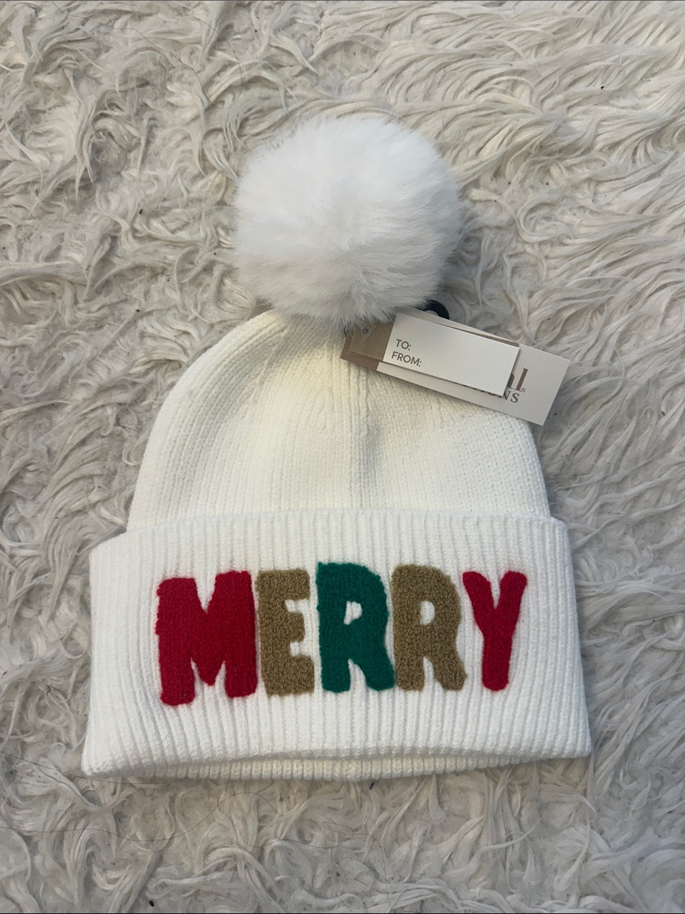 Natural Reflections White Beanie with Colorful "MERRY" Lettering and Pom